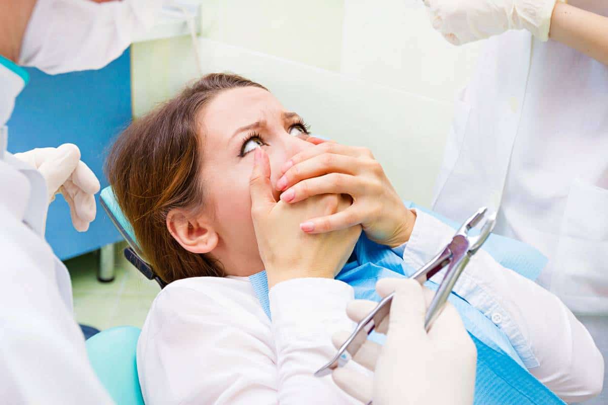 Stressed and anxious patient scared of dental processes